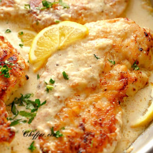 lemon chicken with spaghetti on a plate