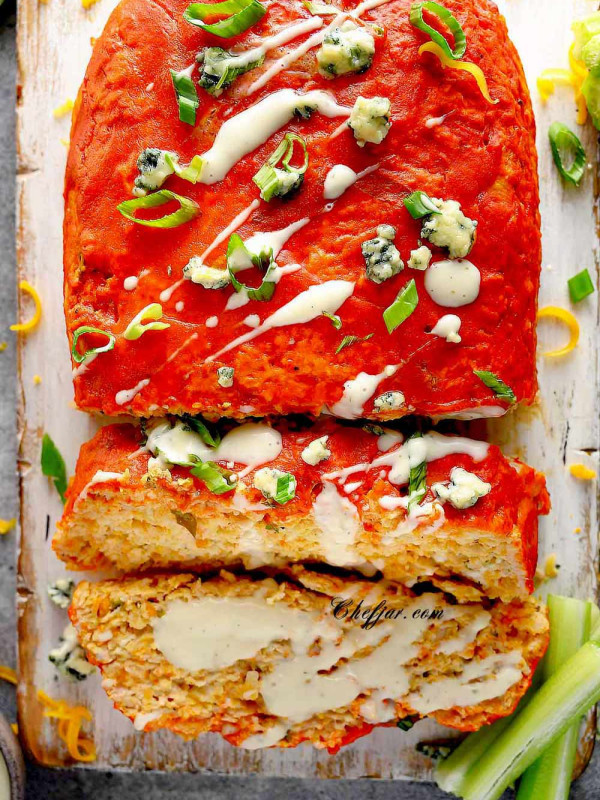 Buffalo Chicken Meatloaf on the cutting board with celery sticks
