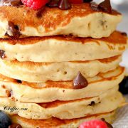 chocolate chip pancake recipe on a plate with berries