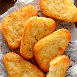 air fried hash browns board lined with parchment paper