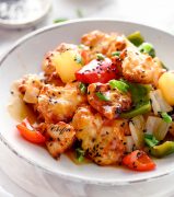 air fryer sweet and sour chicken with veggies and pineapple on a plate