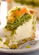 Creamy pistachio baklava cheesecake with a bite out of it / A rich, creamy, PERFECT Pistachio Baklava Cheesecake Recipe! Oh, and there's NO water bath required! #cheesecake #cheesecakerecipe #pistachiocheesecake