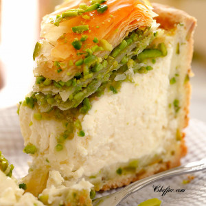 Creamy pistachio baklava cheesecake with a bite out of it / A rich, creamy, PERFECT Pistachio Baklava Cheesecake Recipe! Oh, and there's NO water bath required! #cheesecake #cheesecakerecipe #pistachiocheesecake