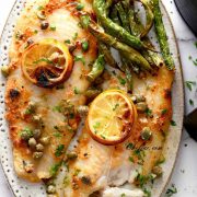 air fried frozen fish fillets on the plate , served with air fryer green beans.