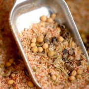 a close up shot of a spoon with salmon seasoning.