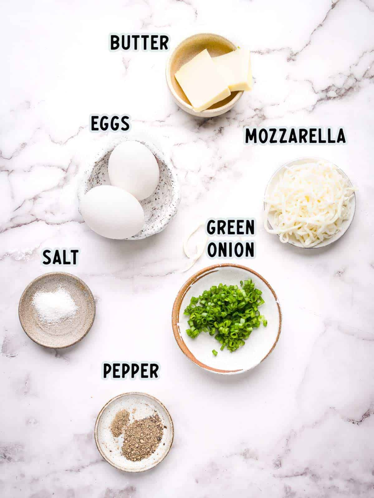 Ingredients to make fluffy scrambled eggs.