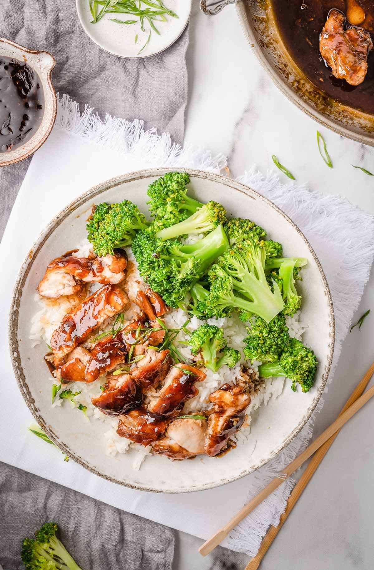 Panda Express Teriyaki Chicken is served with steamed broccoli and rice.