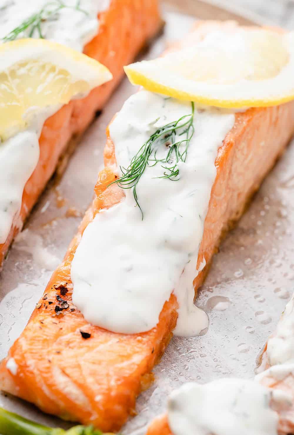 air fryer salmon filets topped with creamy dill sauce