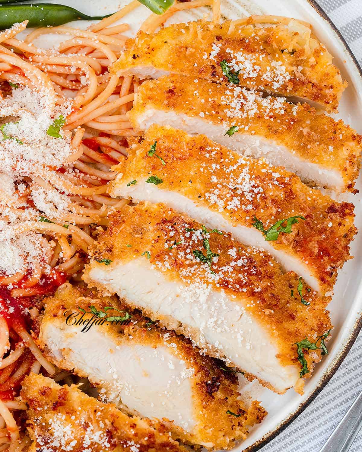 Sliced chicken Romano with spaghetti