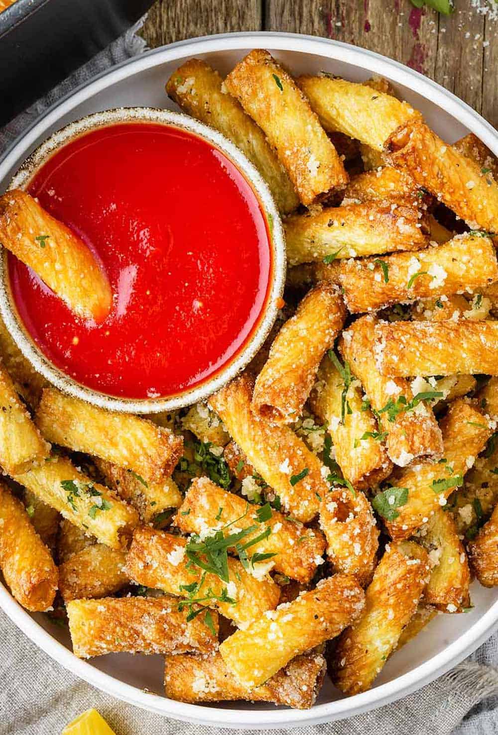 air fryer pasta chips in a bowl with marinara sauce