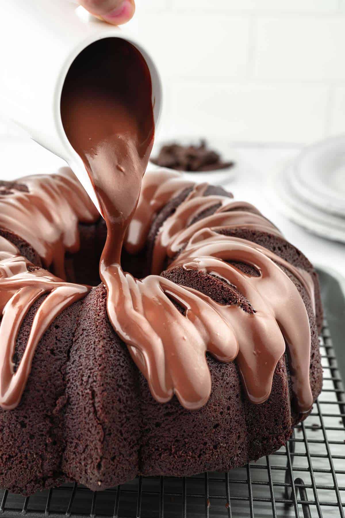 Pouring the Chocolate Ganache over Chocolate Bundt Cake.