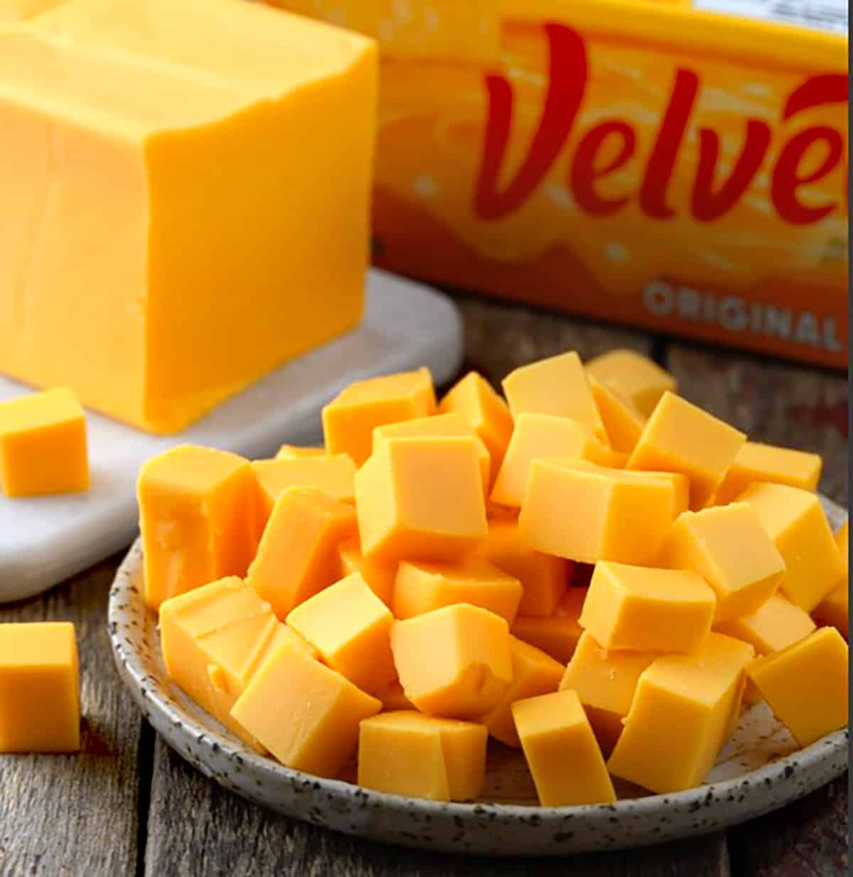 Velveeta cheese is cut into ½-inch cubes. 