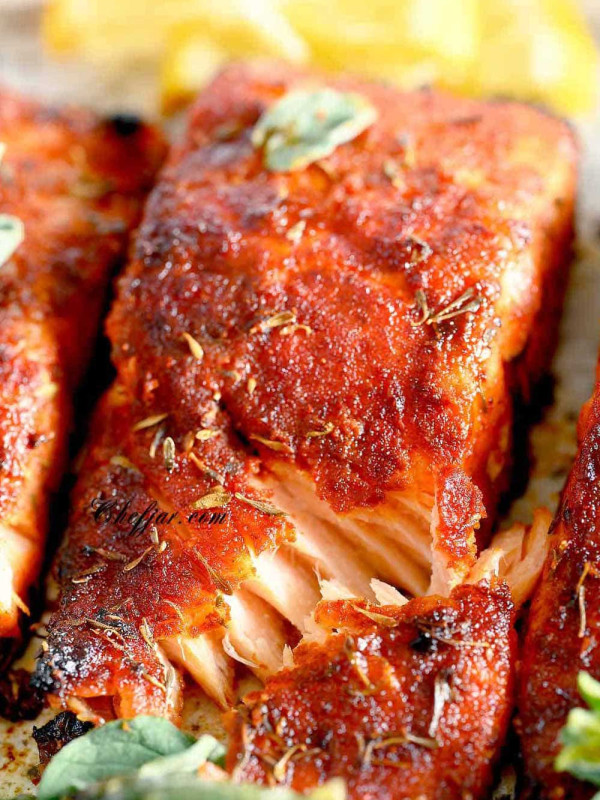 flaky baked salmon on a plate.