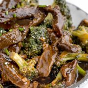 Panda Express Broccoli Beef in a white bowl: Stir-fried beef and broccoli dish with a flavorful sauce.
