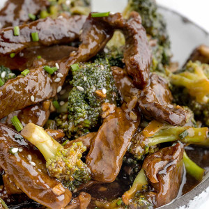 Panda Express Broccoli Beef in a white bowl: Stir-fried beef and broccoli dish with a flavorful sauce.