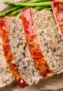 Close-up view of slices of Turkey Quinoa Meatloaf, showcasing its hearty texture and wholesome ingredients.