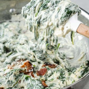 Bacon Boursin Creamed Spinach in skillet: A creamy spinach dish with crispy bacon and rich Boursin cheese.
