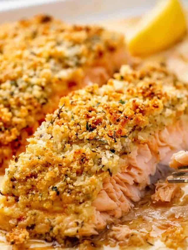Close-up view of a Baked Parmesan Crusted Salmon side fillet, perfectly browned and seasoned.