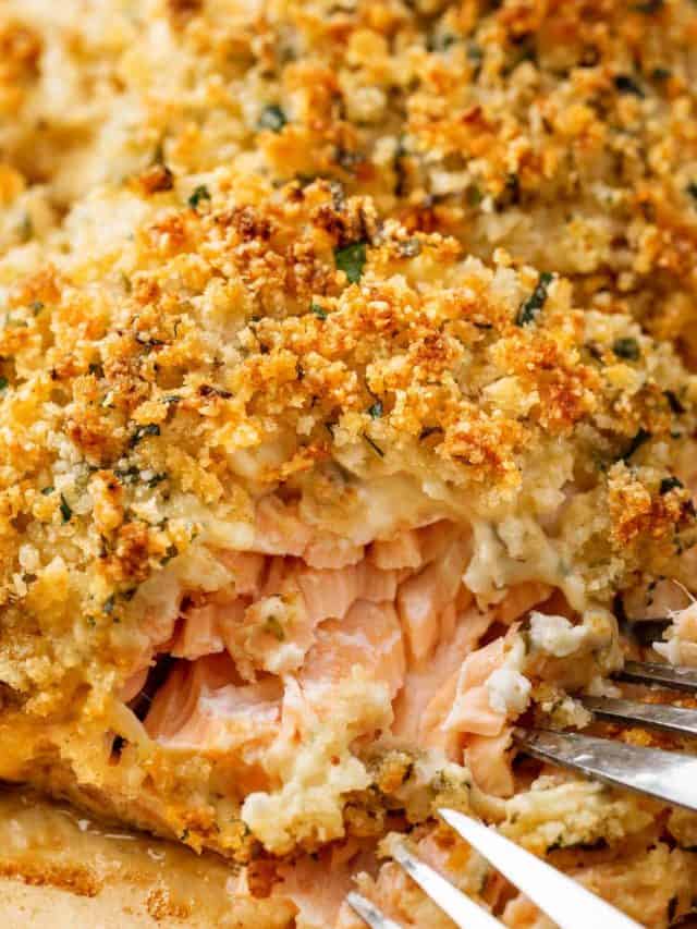 Close-up image of flaky Baked Parmesan Crusted Salmon, showcasing its delicious texture and golden crust.