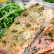 Close-up of a Baked Dijon Salmon fillet, showcasing its Dijon mustard and mayo topping and savory appearance.