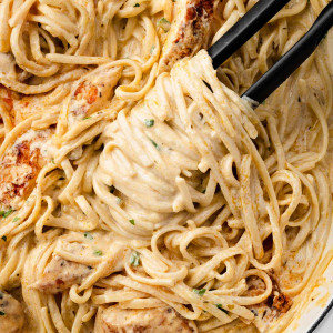 Overhead view of Blackened Chicken Alfredo in a skillet.