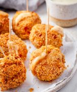 Chicken Cordon Bleu Bites served as appetizers on a plate with toothpicks.