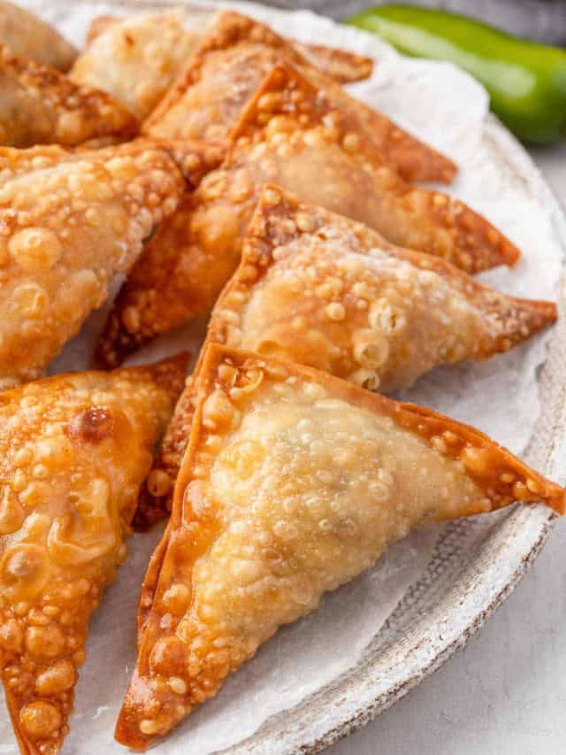 Close-up view of Air fryer Jalapeno Popper Wontons arranged neatly on a plate