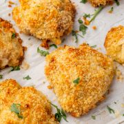 Overhead image of baked ranch chicken thighs on a baking sheet.