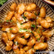 An overhead view of a plate of French Onion Gnocchi.