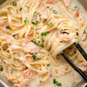 This image features a skillet of Crรจme Fraรฎche Pasta, with tender fettuccine coated in a creamy, tangy sauce.