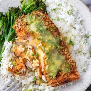 Dijon dill panko crusted salmon served over fluffy white rice with a creamy mustard dill sauce and broccolini on the side.