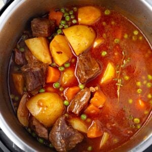 Easy Instant Pot beef stew with tender chuck roast, Yukon Gold potatoes, carrots, and peas in a rich savory broth.